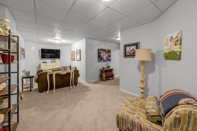 interior space with light carpet and a paneled ceiling