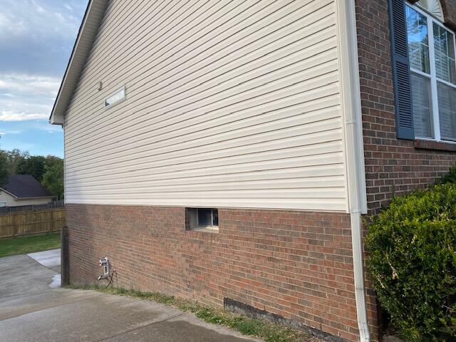 view of side of home featuring a patio