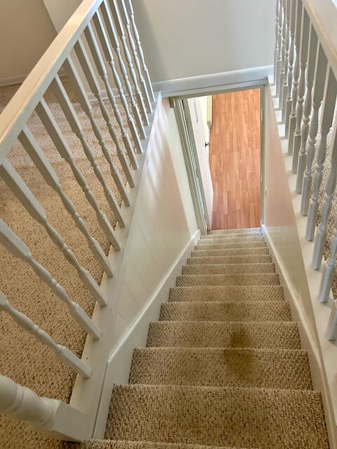 staircase featuring hardwood / wood-style floors