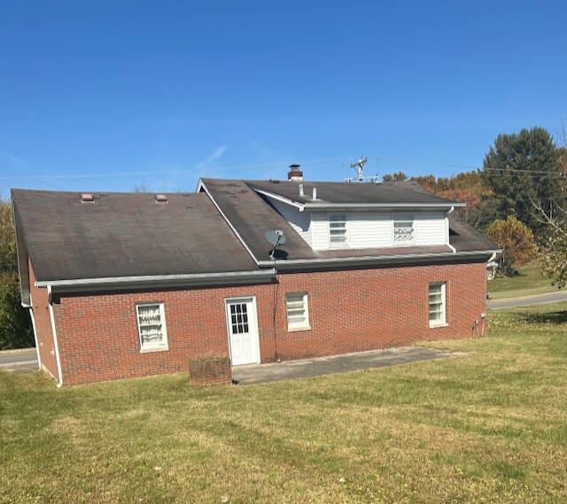 view of property exterior with a lawn