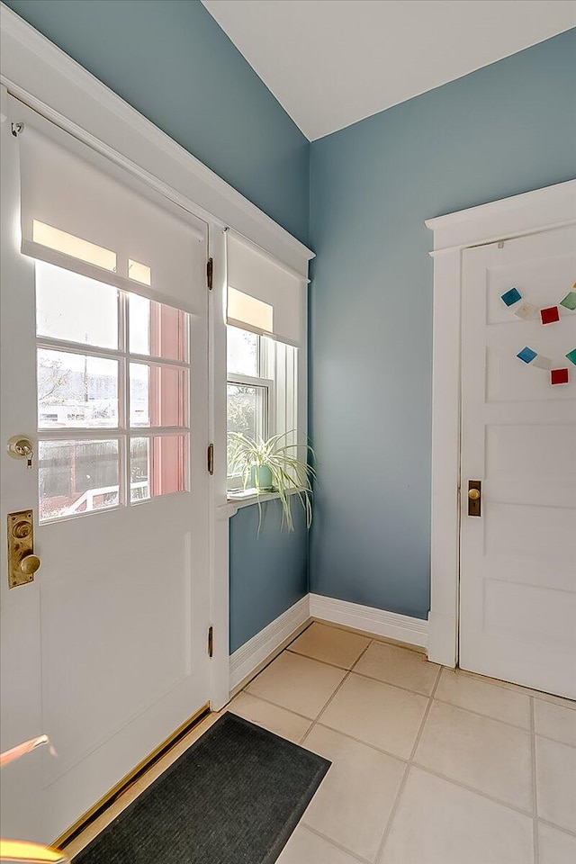 entryway featuring light tile patterned floors