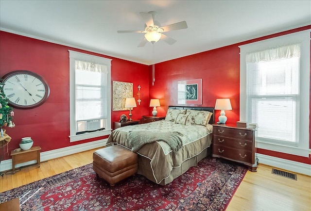 bedroom with hardwood / wood-style floors and ceiling fan