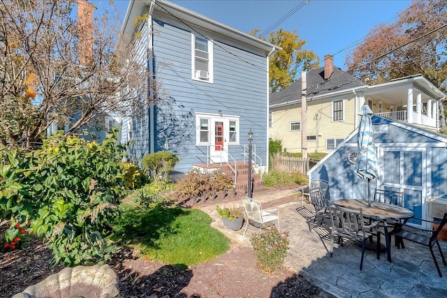 back of house with a patio