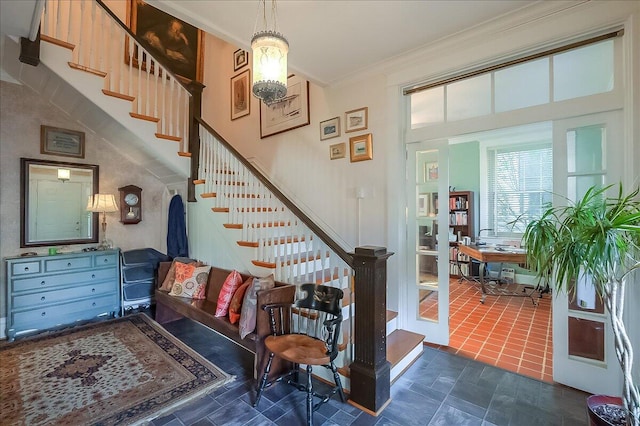 staircase featuring ornamental molding