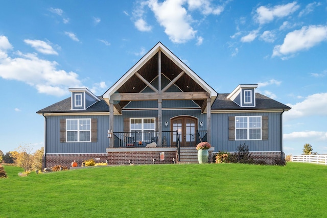 view of front facade featuring french doors and a front lawn