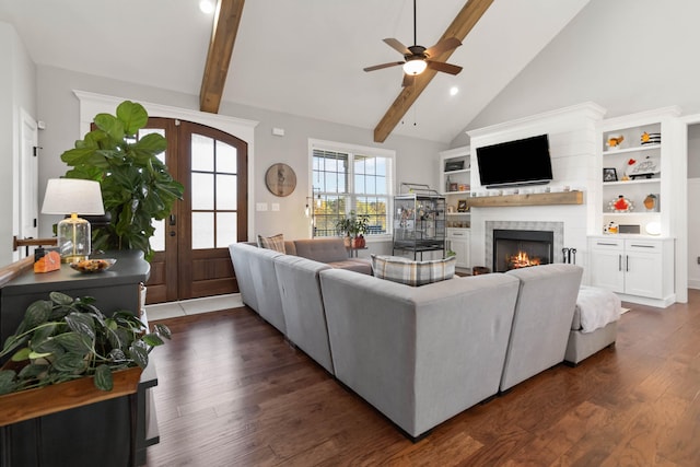 living room featuring french doors, dark hardwood / wood-style floors, beamed ceiling, and ceiling fan