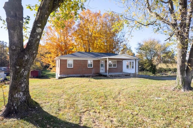 ranch-style home with a front lawn