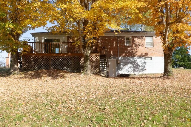 back of house featuring a deck