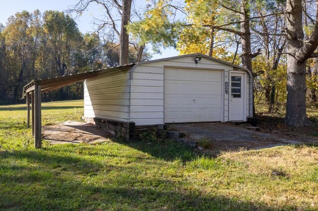 garage with a lawn