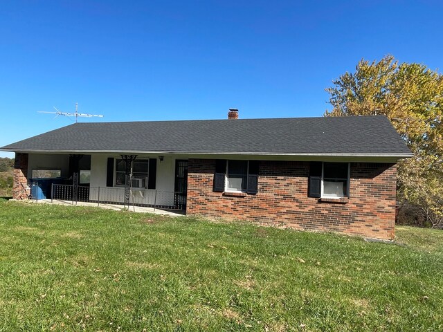 ranch-style home with a front yard