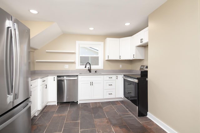 kitchen with appliances with stainless steel finishes, white cabinets, and sink