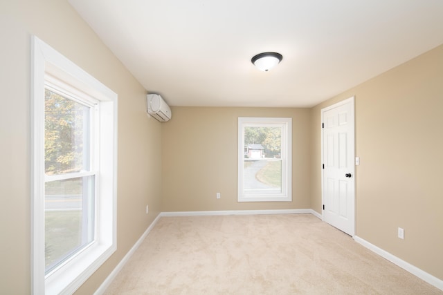 carpeted empty room featuring a wall mounted air conditioner