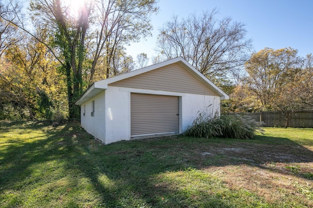 garage featuring a lawn