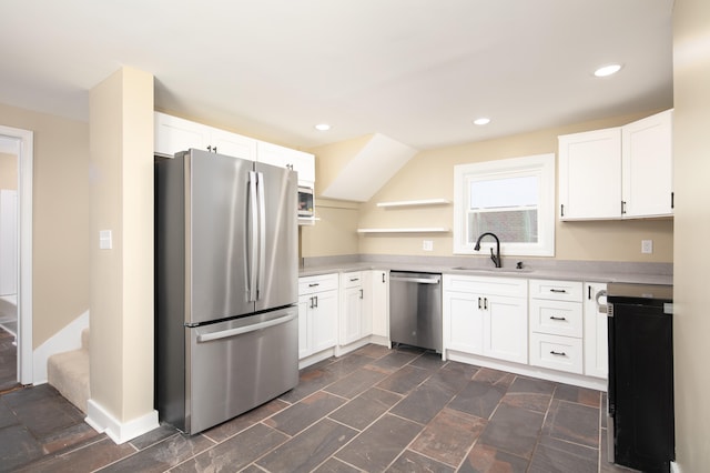 kitchen with sink, white cabinets, and stainless steel appliances