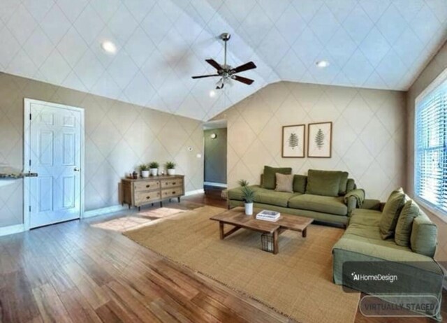 unfurnished living room featuring lofted ceiling, dark hardwood / wood-style flooring, and ceiling fan with notable chandelier