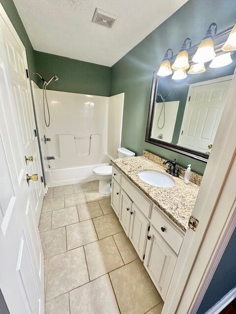 kitchen featuring sink, vaulted ceiling, kitchen peninsula, stainless steel appliances, and white cabinets