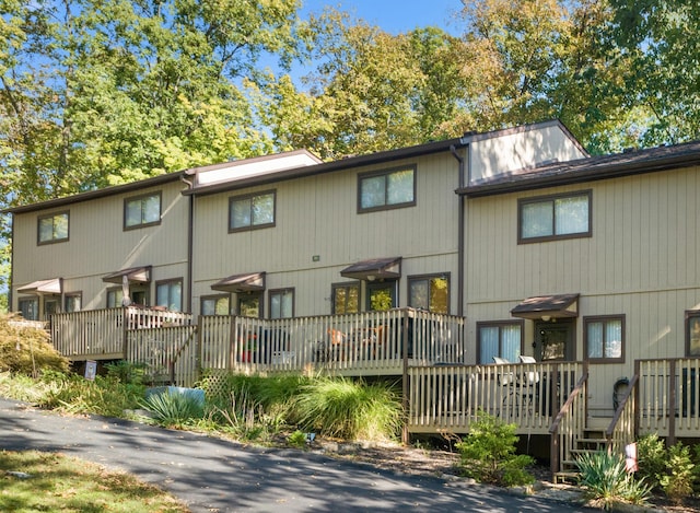 rear view of property with a wooden deck