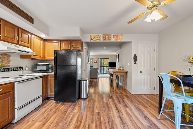 kitchen featuring ceiling fan, light hardwood / wood-style floors, white range with electric stovetop, and black refrigerator