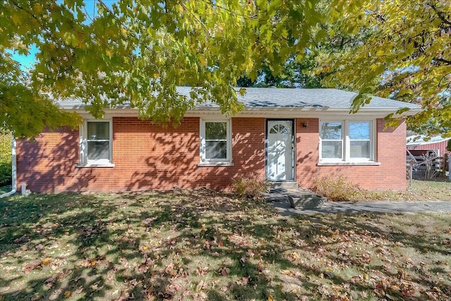 ranch-style home with a front lawn