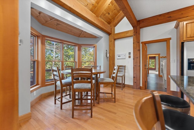 dining room with wood ceiling, vaulted ceiling with beams, light wood-style flooring, and baseboards