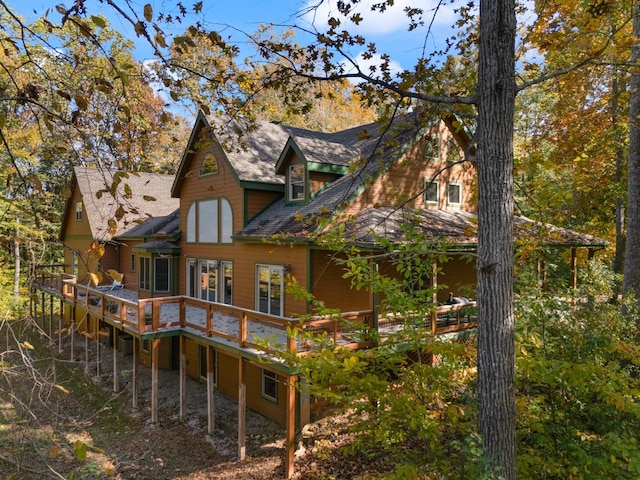 rear view of house with a wooden deck