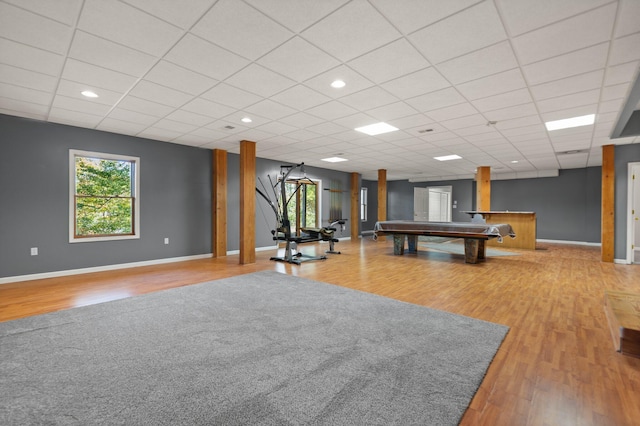 rec room with recessed lighting, wood finished floors, a paneled ceiling, and baseboards