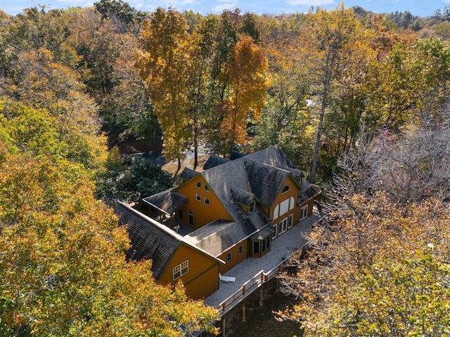 birds eye view of property with a wooded view