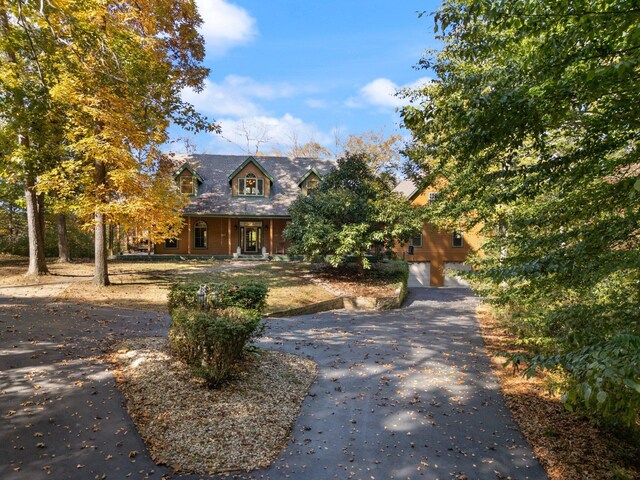 270 Wondering Woods Dr, Somerset, KY 42503 - view of front of house featuring asphalt driveway, a porch, and a garage