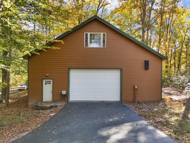 270 Wondering Woods Dr, Somerset, KY 42503 - garage with asphalt driveway and a garage