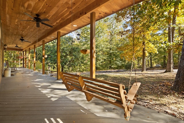 wooden deck featuring ceiling fan