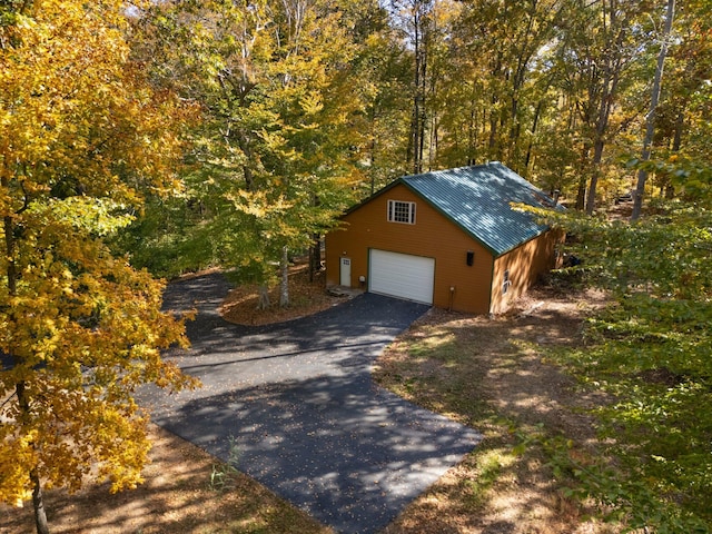 exterior space with a detached garage