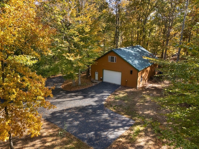 270 Wondering Woods Dr, Somerset, KY 42503 - view of front of home with a detached garage, an outbuilding, driveway, and metal roof