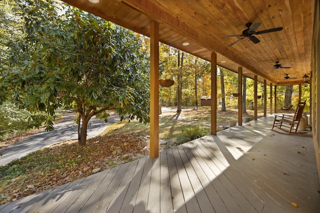 wooden terrace with a ceiling fan