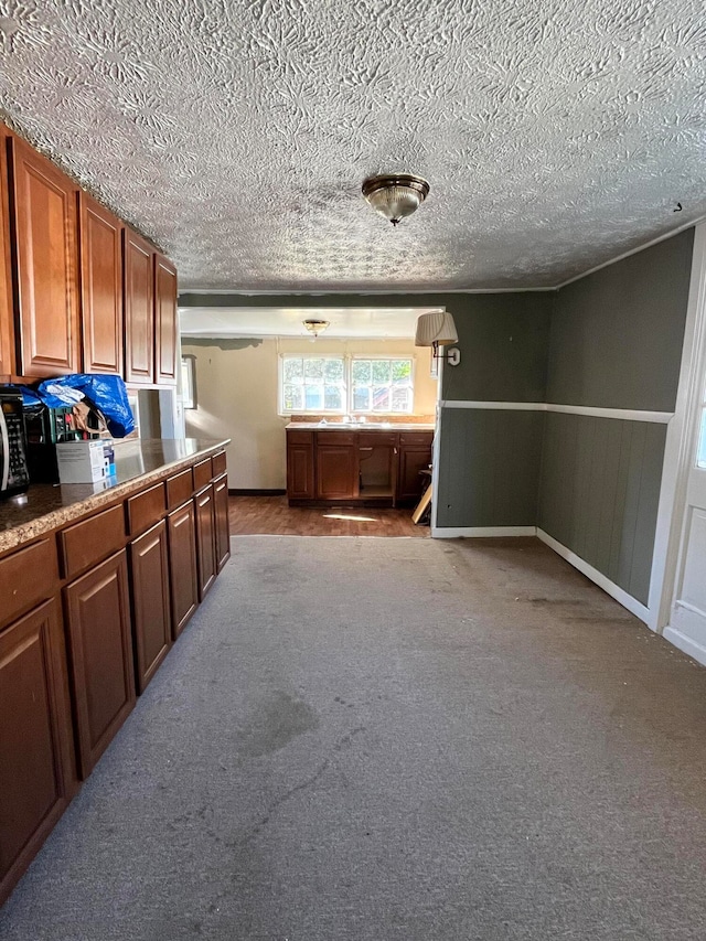 interior space with light carpet and a textured ceiling