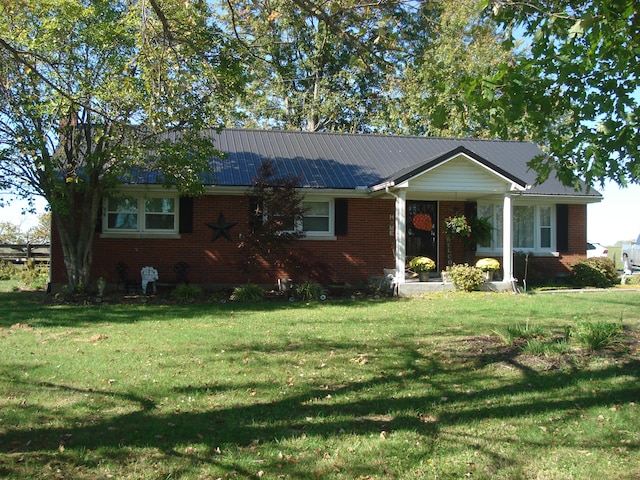 single story home with a front yard