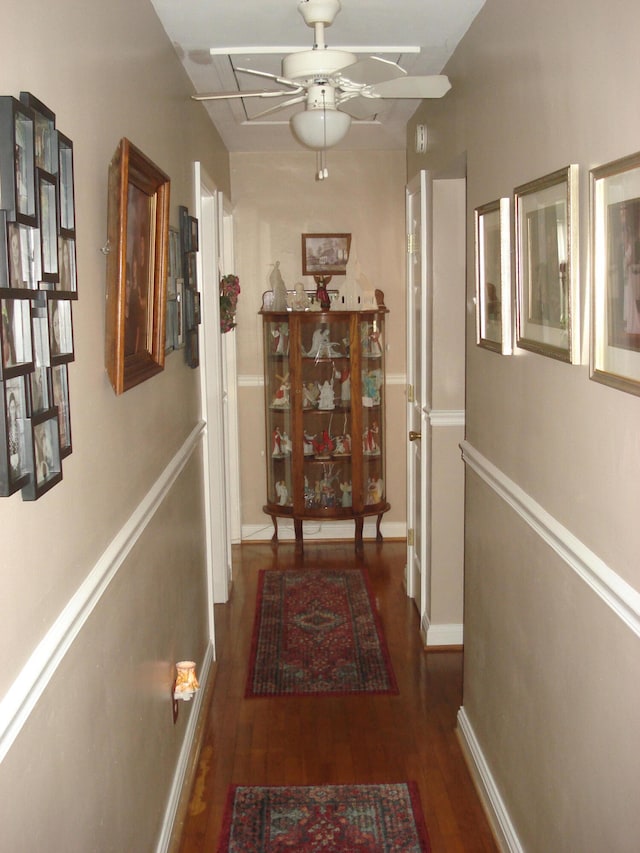 corridor featuring dark wood-type flooring