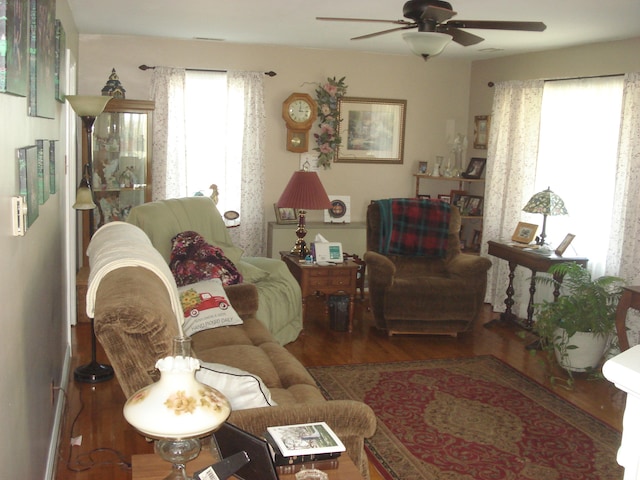 living room with hardwood / wood-style floors, plenty of natural light, and ceiling fan