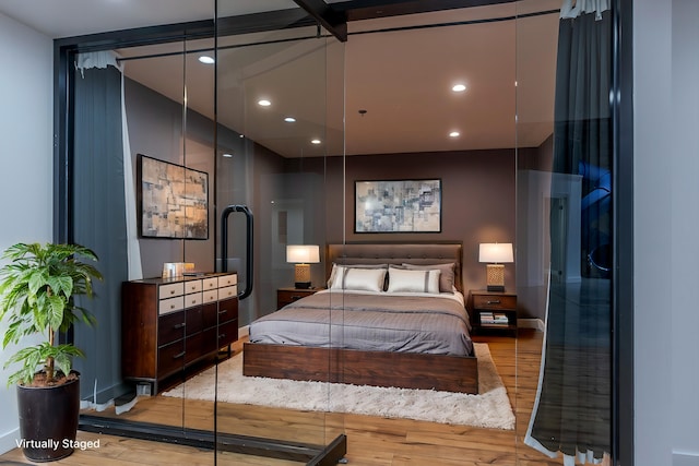 bedroom with light hardwood / wood-style floors