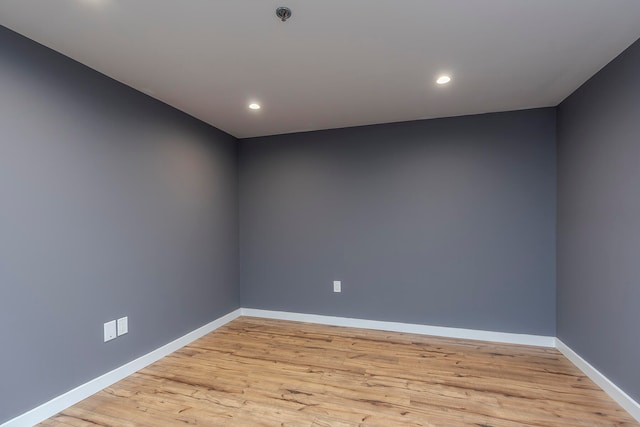 empty room with light hardwood / wood-style flooring