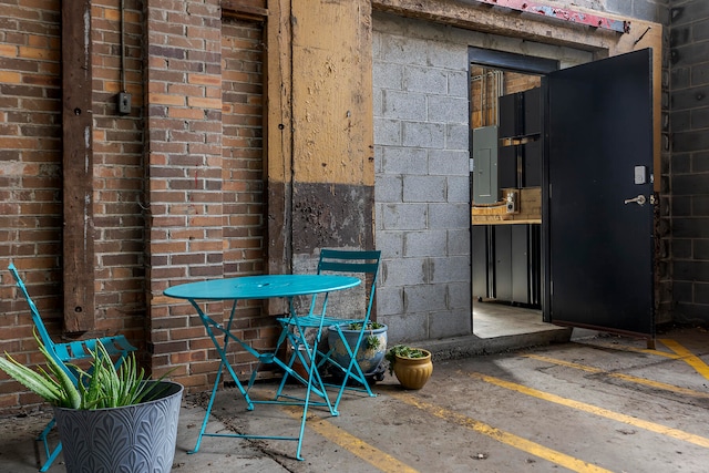 view of patio / terrace featuring electric panel