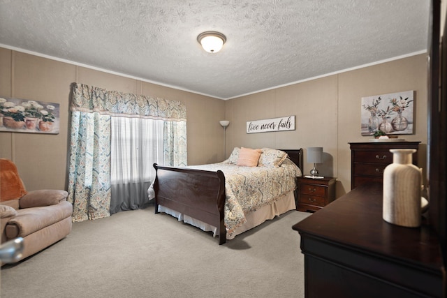 carpeted bedroom featuring ornamental molding and a textured ceiling