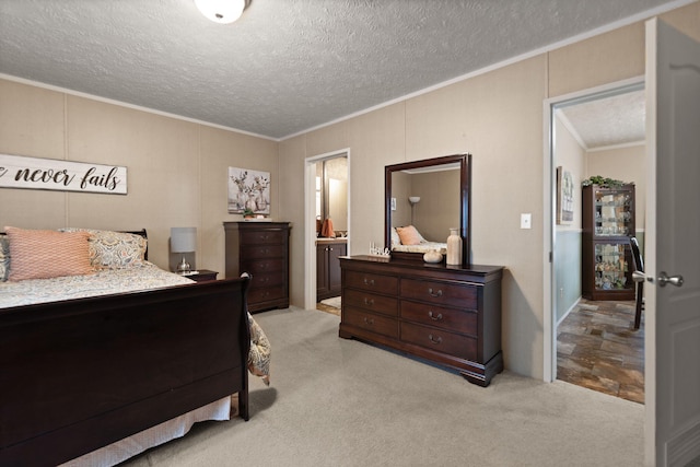 bedroom with connected bathroom, crown molding, light carpet, and a textured ceiling