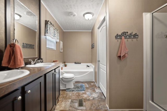 bathroom with vanity, a textured ceiling, and shower with separate bathtub