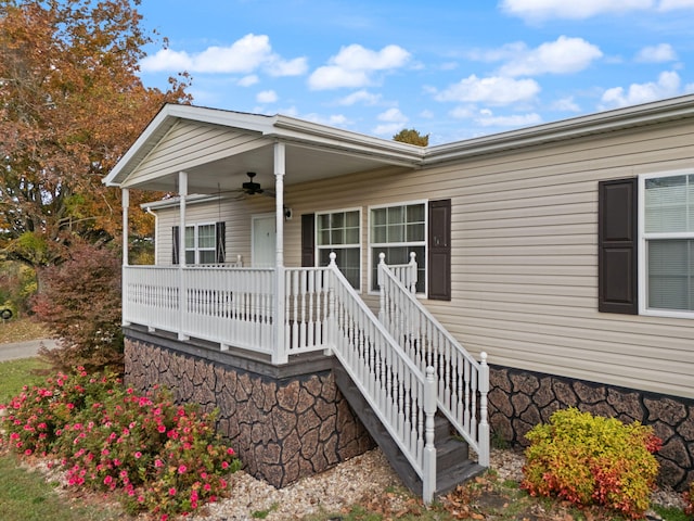 entrance to property featuring ceiling fan