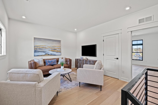 living room with light hardwood / wood-style floors