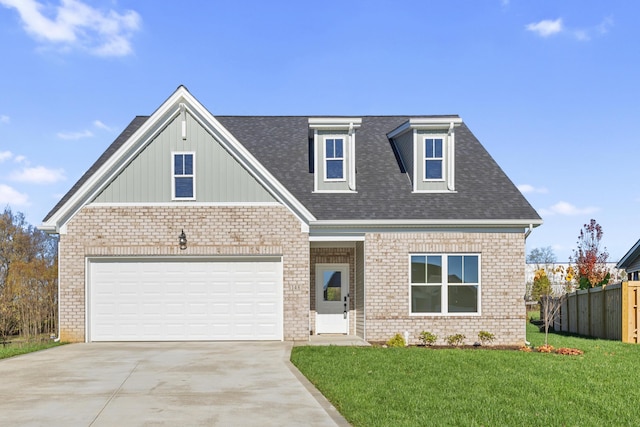 view of front of house featuring a front yard and a garage