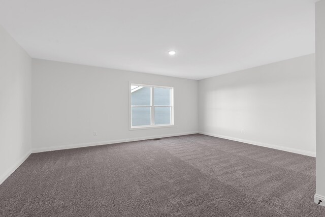 148 Nuthatch Trl, Georgetown, KY 40324 - empty room featuring dark colored carpet and baseboards