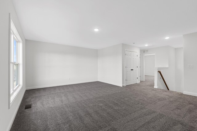 148 Nuthatch Trl, Georgetown, KY 40324 - spare room with dark colored carpet, baseboards, plenty of natural light, and recessed lighting