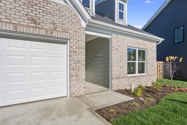 148 Nuthatch Trl, Georgetown, KY 40324 - entrance to property featuring brick siding, a shingled roof, concrete driveway, and a garage