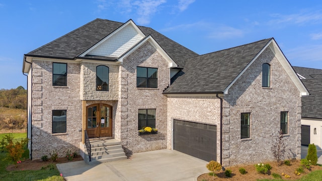 french country inspired facade featuring a garage